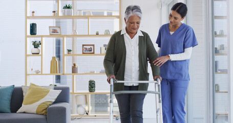 Women, nurse and elderly patient with walker for recovery, physiotherapy or rehabilitation in home. Female people, caregiver and helping senior person with a disability for assisted living in house