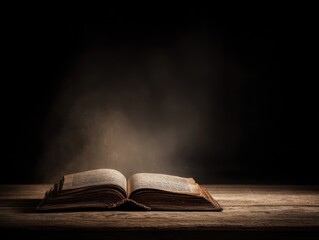 Old open book on wooden table