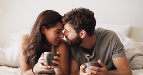 Couple, forehead and tea in bed with calm, moment and connection for bonding in home. Woman, man...