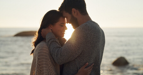 Couple, smile and love with sunset on beach for summer vacation, romantic date and bonding. Happy, man and woman with travel, tropical holiday and affection for relationship and commitment at ocean