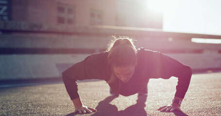 Outdoor, push ups and woman on road, fitness or workout routine for core strength, healthy and city. Bodybuilder, wellness and training for muscle power, endurance and exercise for body stability