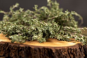 green thyme tied in small bundles, aromatic spices of dried thyme for use in cooking and folk...