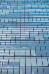 modern office building in the city with blue glass walls