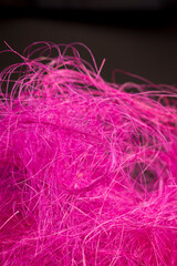 pink threads dyed red for decorative work and creative work of artisans, close up