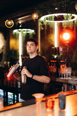 Cocktail Bartender Mixing Drinks in a Stylish Bar Setting