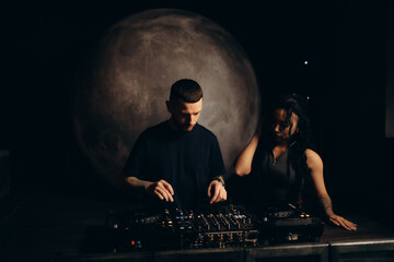 Musicians Performing In A Dark Ambient Club With Professional Audio Equipment