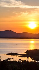 Sunset over lake and mountains