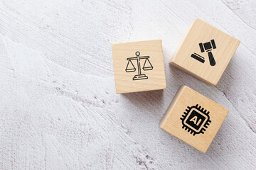 Wooden blocks with icons of AI, law, and justice scale, concept of legal challenges, ethical...