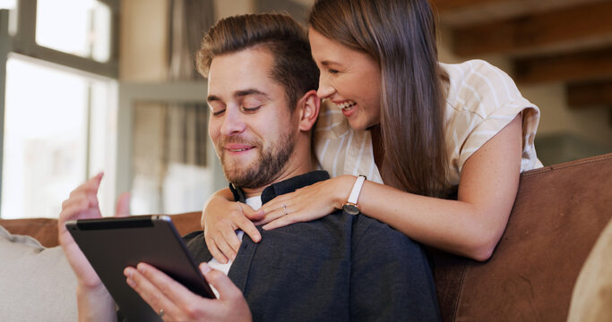 Tablet, smile and couple on sofa in home with social media, networking or communication online. Happy, love and man with woman on digital technology for contact in living room together at apartment. - Powered by Adobe