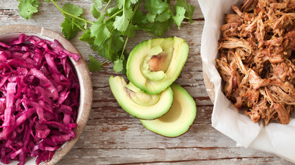 A vibrant arrangement of Mexican street food on a rustic wooden surface.