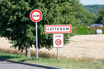 Cattenom in France, street sign, town of Nuclear power plant, air pollution, environment and energy...