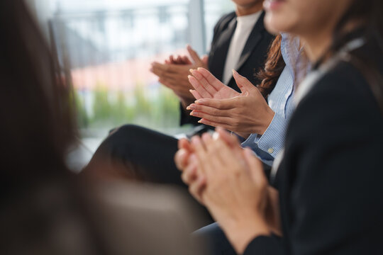 Business people clapping hands after a successful presentation