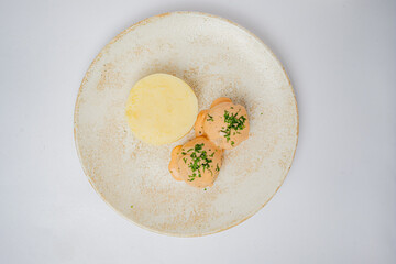 Creamy textures and vibrant colors come together on a simple plate, inviting taste and admiration