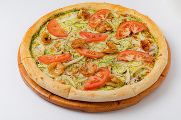 Freshly baked pizza with shrimp, ripe tomatoes, and green herbs is a delicious treat