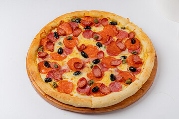 Freshly baked pizza featuring spicy pepperoni, black olives, and jalapenos on a golden crust