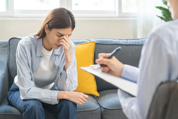 Psychology, depression. Suffer asian young woman consultation with psychologist while patient...