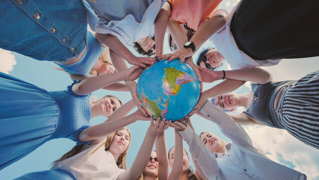 School friends unite in support of environmental awareness, global citizenship, and international cooperation by holding a globe