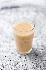 Pineapple coconut smoothie on bright background. Soft focus. Copy space.	