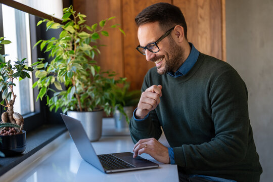 Young business man manager or teacher talking to camera having remote video conference call meeting