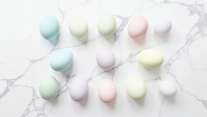 Elegant spring composition with pastel-colored eggs on a white marble countertop, a festive Easter background.