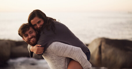 Ocean, love and happy couple with piggyback on holiday, vacation and date together. Smile, man and...