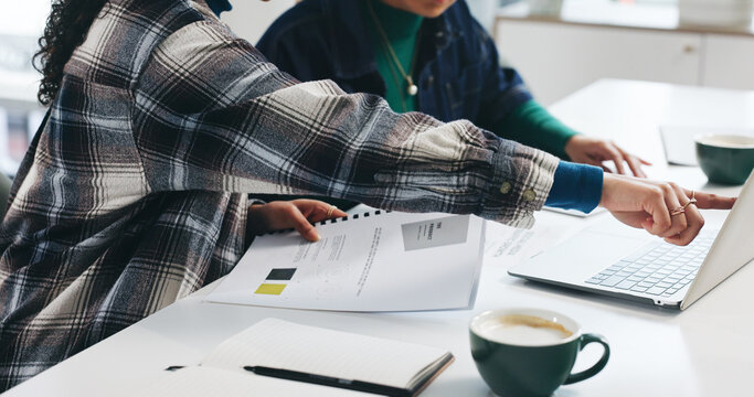 Collaboration, laptop and discussion with business women in office for feedback, review or report. Computer, teamwork or paperwork with employee pointing with design document, project and planning