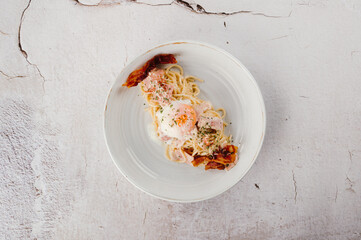 Creamy Pasta Dish with Bacon and Egg Overhead View