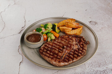 Grilled Ribeye Steak with Roasted Potatoes and Vegetables