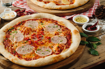 Savory Sausage Pizza with Red Pepper Flakes on Rustic Wooden Table