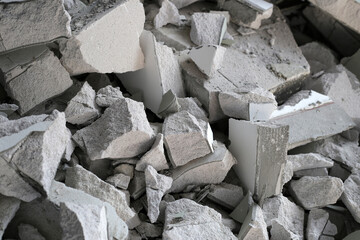 Broken concrete, Piles of lightweight construction bricks after house demolition