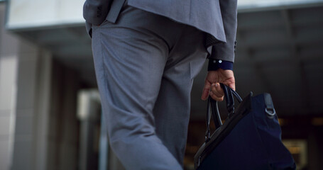 Businessman, hands and bag in city for travel, morning commute and journey to work. Professional,...