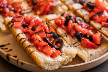 party appetizer bruschettas with fresh tomato and balsamic glaze, delicious and colorful snack, perfect for parties, gatherings, or festive occasions