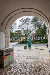 Girl with the Suitcase, bronze sculpture by Joao Duarte at the entance to the old town of Setubal,...