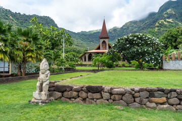 Tiki statue in front of the Vaitahu church, Tahuata, Marquesas Islands, French Polynesia © daboost