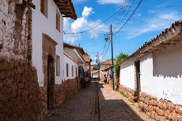Traditional cobbled streets in Chinchero, Peru, with white adobe walls