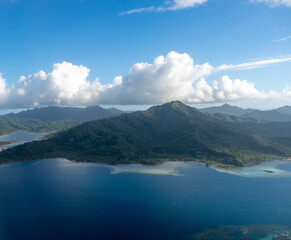 Aerial view of Tahaa island, French Polynesia, with turquoise lagoon and reef © daboost