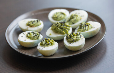fun halloween green deviled eggs party appetizer close up
