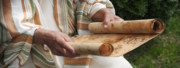 Old man reading the scroll