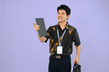 young man wearing batik shirt looking surprised 