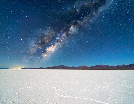 Vast White Salt Flat Landscape Under a Starry Night Sky