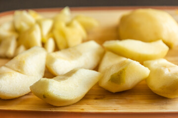 fresh healthy pear slices fruit close up on wood board