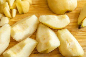fresh healthy pear slices fruit close up on wood board