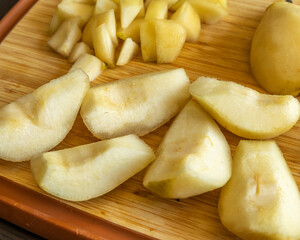 fresh healthy pear slices fruit close up on wood board