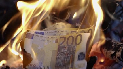 Burning euro banknotes in fire - Powered by Adobe
