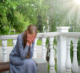 Crying woman in the park