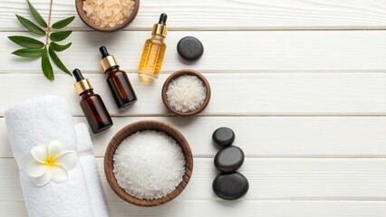 Beauty treatment items for spa procedures on white wooden table. massage stones, essential oils and sea salt. copy space. spa still life with cosmetics