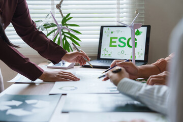 Business people discussing esg environmental social governance investment concept