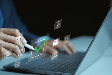 Survey and evaluation concept, Businessman touching digital check mark icon for approval and quality assessment on digital document, Business checklist management and performance tracking