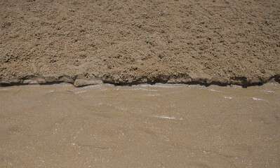 Close up view of a sand on a beach in the summer.