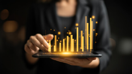 Digital tablet displaying financial growth chart with glowing bars business professional analyzing data trends modern technology in finance